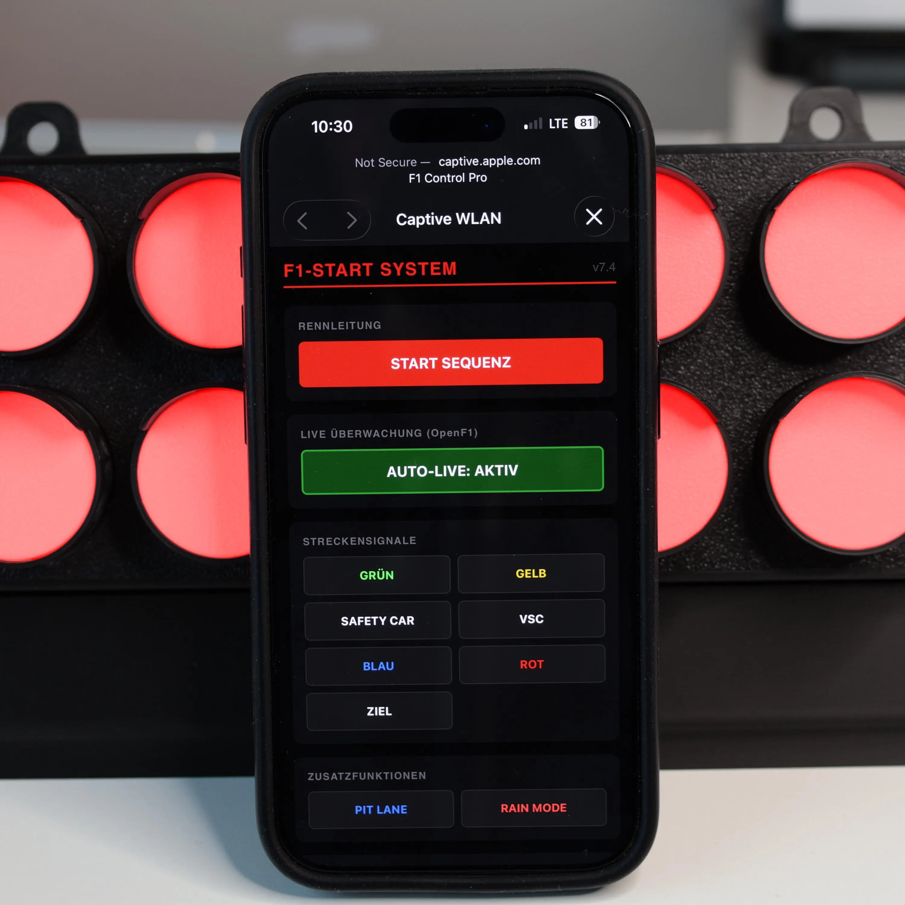 Live F1 session status interface in front of the illuminated APEX Start Light