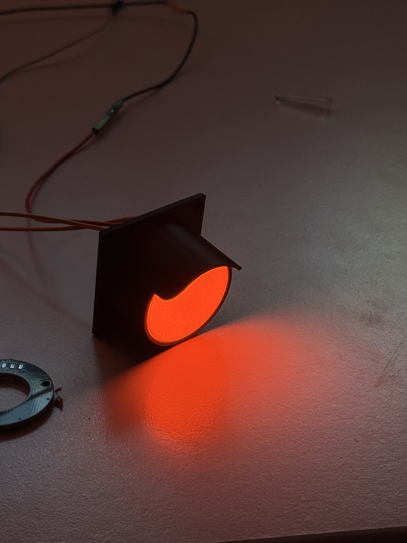 Early single-light APEX prototype illuminated in red