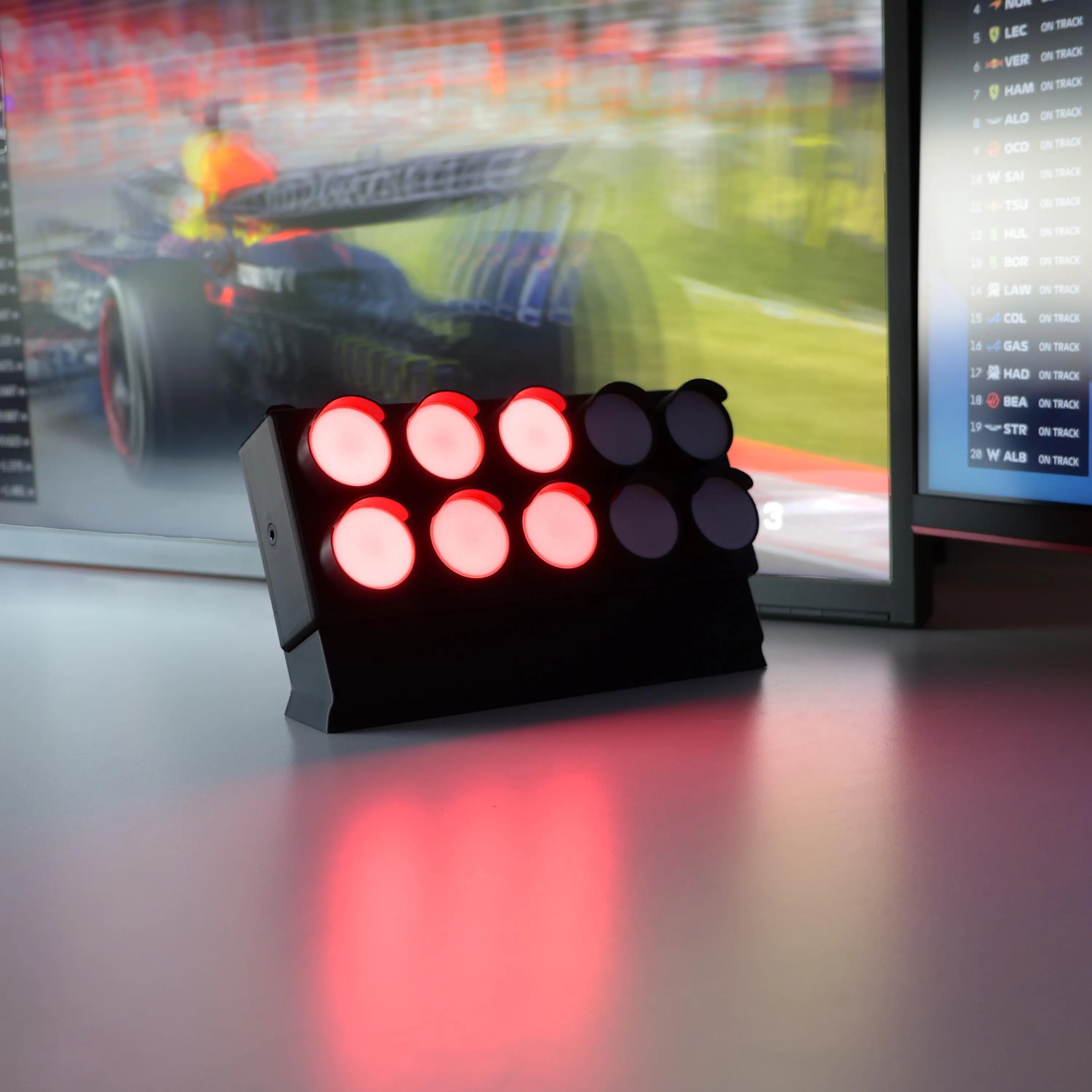 APEX Start Light active in front of a racing display